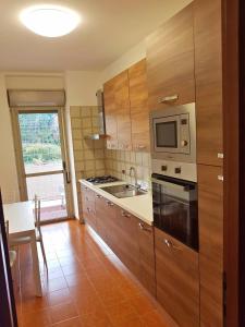 A kitchen or kitchenette at Casa Stazione Magliana