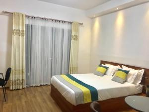 Postel nebo postele na pokoji v ubytování Hôtel Sky blue Mada