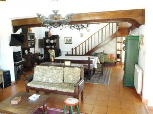 a living room with a couch and a table at BCL12V3 Antiga Azenha convertida num alojamento tu in Barcelos