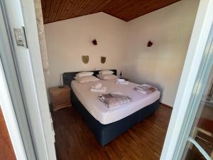 Postel nebo postele na pokoji v ubytování Apartments Šuda