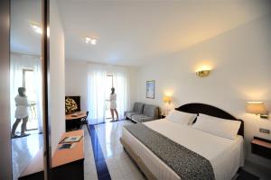 Postel nebo postele na pokoji v ubytování Hotel Royal Positano