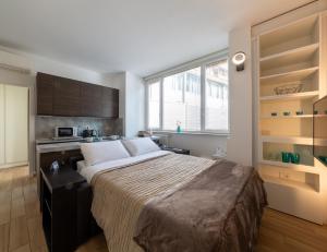 Postel nebo postele na pokoji v ubytování AC Central Loft