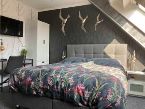 Postel nebo postele na pokoji v ubytování Hotel Dichtbijzee