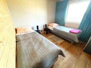 Ένα ή περισσότερα κρεβάτια σε δωμάτιο στο apartament z jacuzzi sępopol +14 φωτογραφίες