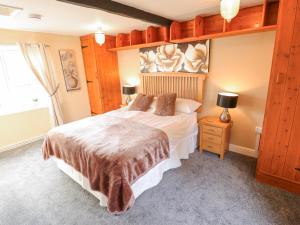 Katil atau katil-katil dalam bilik di Beech Cottage