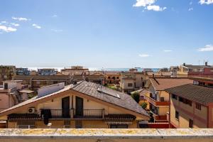 a view of a city with buildings at Fly and Swim, Glamour House in Fiumicino