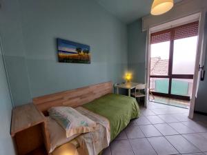 Postel nebo postele na pokoji v ubytování Cà dell'Angelo
