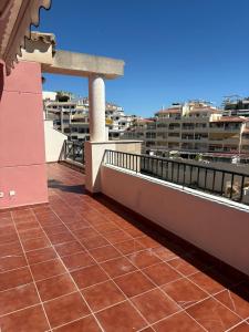 a balcony with a view of the city at El Ático de Brisaquebrada - Vista Mar - Gran Terraza in Benalmádena