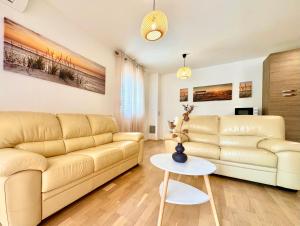 a living room with a couch and a table at Apartments Terra Solaris in Medulin