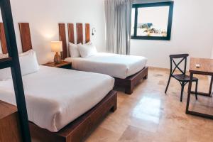 Katil atau katil-katil dalam bilik di Hotel B10 - Distinctive Hotel-