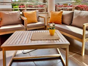 a living room with couches and a table with a coffee table at Apartments Terra Solaris in Medulin