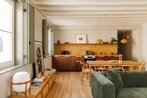 a living room with a couch and a table at The Verse in Lisbon