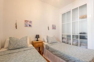 Ένα ή περισσότερα κρεβάτια σε δωμάτιο στο Casa LULU a hidden gem on the Costa de la Luz