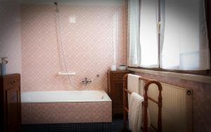 a bathroom with a bath tub and a window at Casa Flo' in Marina di Carrara +29 photos