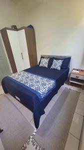 Postel nebo postele na pokoji v ubytování Casa Caminhos de Ubá