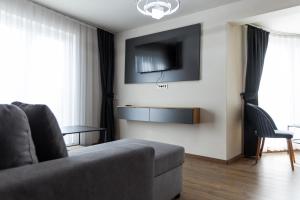 TV a/nebo společenská místnost v ubytování Vetus Hotel