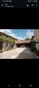 a screenshot of a picture of a house and a picture of a building at La Cour in Villefagnan