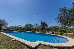 a swimming pool in the yard of a house at Innouthome Casa Rural_el Nostre Cantir in L'Ametlla de Mar