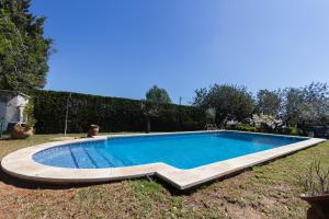 a swimming pool in the yard of a house at Innouthome Casa Rural_el Nostre Cantir in L'Ametlla de Mar