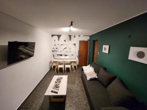 a living room with a couch and a table at Departamento Primi in Mendoza