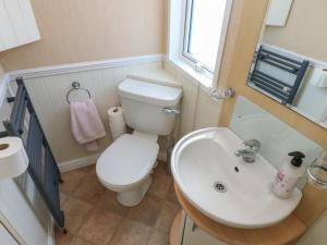 a small bathroom with a toilet and a sink at New Horizon in Carlisle +13 photos