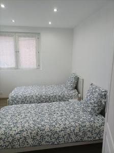 a bedroom with a bed and two pillows at Maison individuelle Rosières-en-Santerre in Rosières-en-Santerre +7 photos