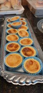 a tray of cupcakes sitting on a table at Hotel União in Pojuca +6 photos