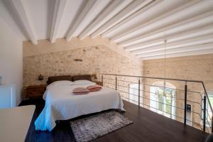 a bedroom with a bed and a balcony at Villa Santa Margherita in Chiaramonte Gulfi +128 photos