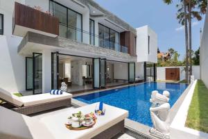 an image of a house with a swimming pool at Villa Damar Canggu by Nagisa Bali in Canggu