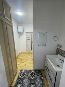 Kuchyň nebo kuchyňský kout v ubytování Olimxon Guest House