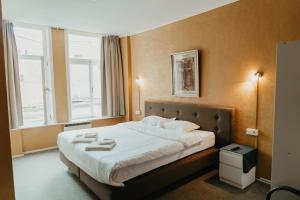 Postel nebo postele na pokoji v ubytování Hotel Cavalier