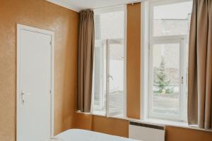 Postel nebo postele na pokoji v ubytování Hotel Cavalier