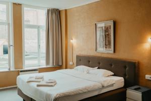 Postel nebo postele na pokoji v ubytování Hotel Cavalier