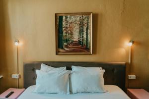 Postel nebo postele na pokoji v ubytování Hotel Cavalier