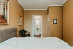 Postel nebo postele na pokoji v ubytování Hotel Cavalier