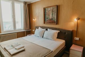 Postel nebo postele na pokoji v ubytování Hotel Cavalier