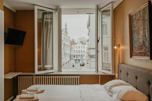 Postel nebo postele na pokoji v ubytování Hotel Cavalier