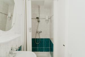 Koupelna v ubytování Hotel Cavalier