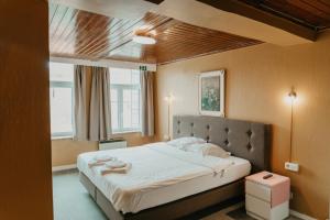 Postel nebo postele na pokoji v ubytování Hotel Cavalier + 37 fotografií