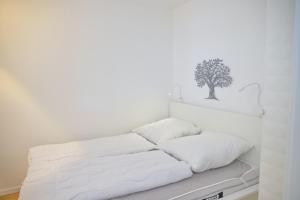 Postel nebo postele na pokoji v ubytování Grömitz- Center I App 321 inkl WLAN "3-2-1-Meins!"