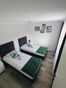Posteľ alebo postele v izbe v ubytovaní Apartament Sumik