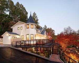 a large white house with a ramp leading up to it at Okaeri in Calistoga