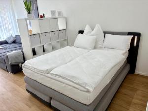 Postel nebo postele na pokoji v ubytování Cityapartment direkt am Hafen