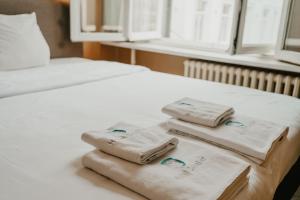 Postel nebo postele na pokoji v ubytování Hotel Cavalier
