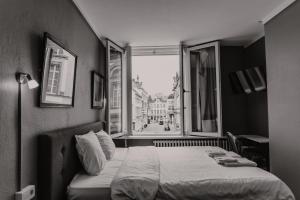 Postel nebo postele na pokoji v ubytování Hotel Cavalier