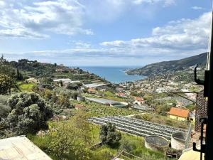 a view of a town with the ocean in the background at Suite Maurixe 34 - Sanremo in Sanremo