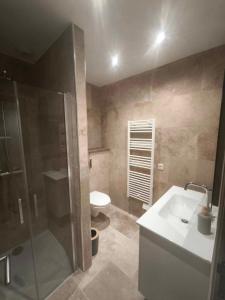 a bathroom with a shower and a sink and a toilet at Casa di Mela in Mela +24 photos