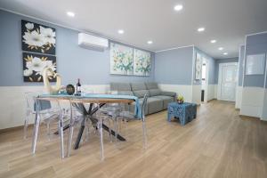 a living room with a table and a couch at Terrazza Luxury Costa Adeje in Adeje