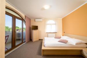 Ένα ή περισσότερα κρεβάτια σε δωμάτιο στο Penthouse Aurora