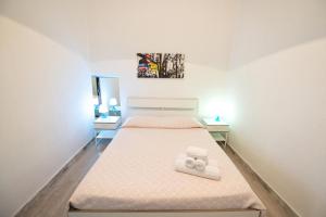 a bedroom with a bed with two night stands at Disiu Case Vacanza in Balestrate